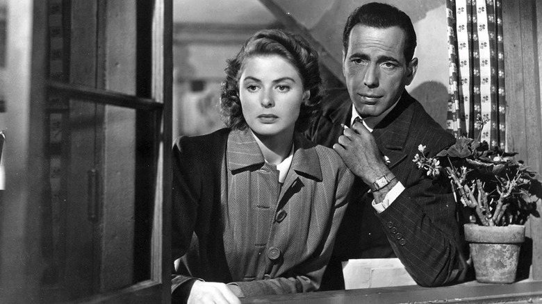 Rick Blaine (Humphrey Bogart) and Ilsa Lund (Ingrid Bergman) stare from a window in Casablanca