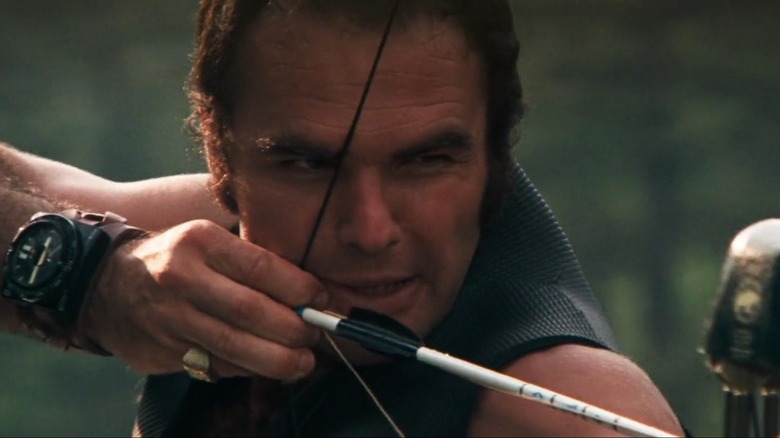 Burt Reynolds as Lewis in Deliverance, drawing and aiming his cross bow.