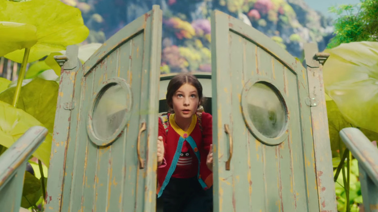 Billie Gadsdon as Fran emerging through the green doors in The Magic Faraway Tree