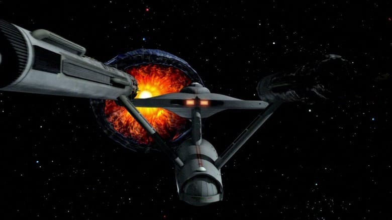 The Enterprise flying toward a planet-eating monster on Star Trek