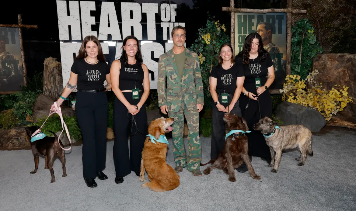 Paramount Pictures' "Heart Of The Beast" Global Premiere Brad Pitt, four women, and four dogs pose at the "Heart Of The Beast" global premiere.