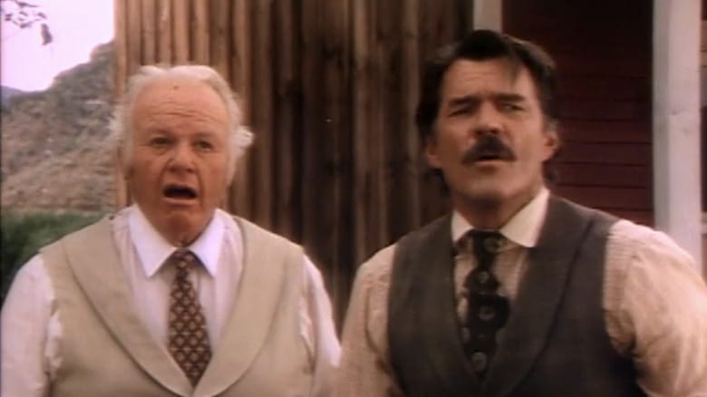 Alan Hale Jr.'s Doc Kaminsky stands beside Cal Bartlett's Bill outside in The Red Fury