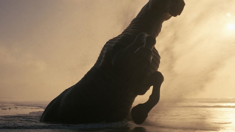 The Trojan Horse sticking out of the ocean in The Odyssey