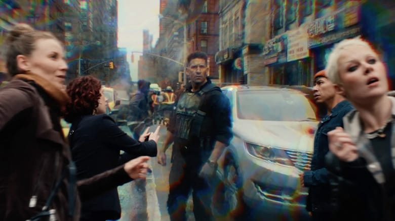 The Punisher stands in the street surrounded by civilians frozen by Jean Grey's mutant powers in Spider-Man: Brand New Day
