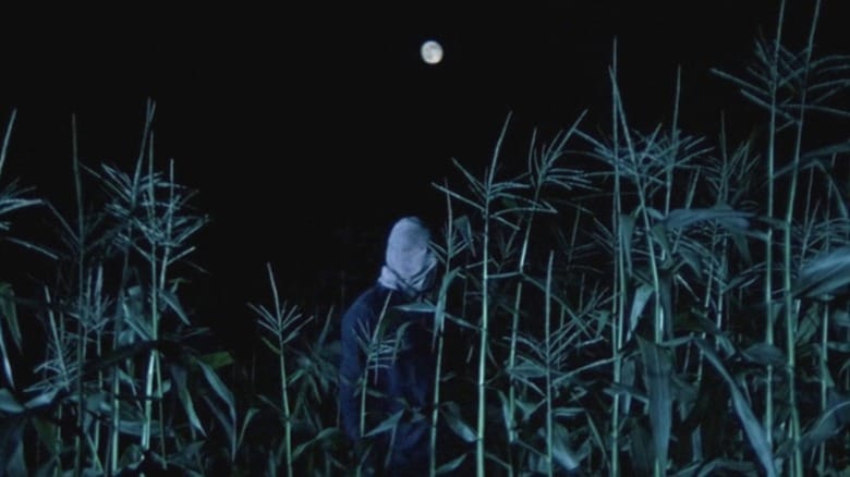 Bud Davis' Phantom Killer walks through a corn field in The Town that Dreaded Sundown