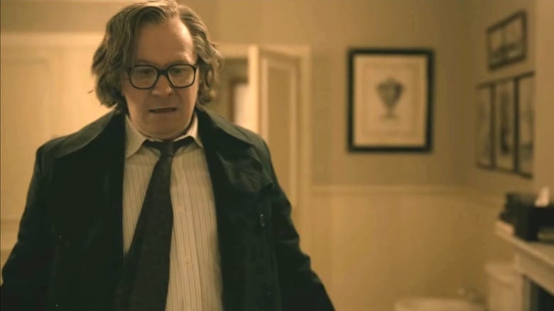 Gary Oldman's Jackson Lamb looks worried as he stands in Charles Partner's bathroom in Slow Horses