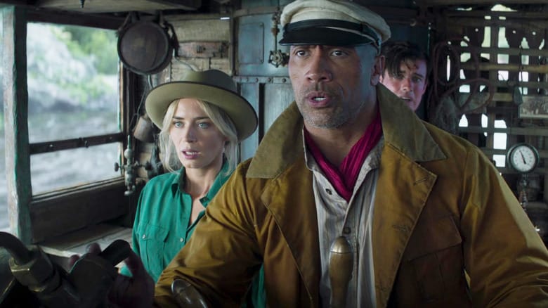 Emily Blunt as Lily Houghton, Dwayne Johnson as Frank Wolff, and Jack Whitehall as MacGregor Houghton looking scared on Frank's steamboat in Jungle Cruise