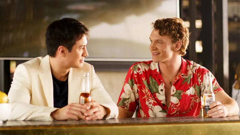 Hudson Williams as Shane Hollander and Connor Storrie as Ilya Rozanov talk in a bar in Heated Rivalry
