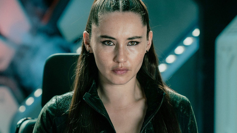 Christina Chong as La'an Noonien-Singh wearing an all-black outfit and sitting at the controls of a shuttlecraft in Star Trek: Strange New Worlds