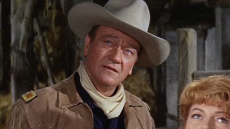 Matt Masters wearing cowboy hat and looking upwards in Circus World