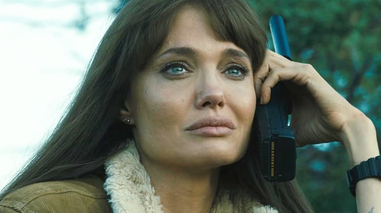 Angelia Jolie as Hannah Faber with tears in her eyes holding a walkie talkie up to her ear in Those Who Wish Me Dead