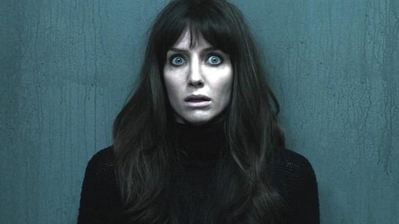 Annabelle Wallis as Madison with wide eyes against a wall in Malignant