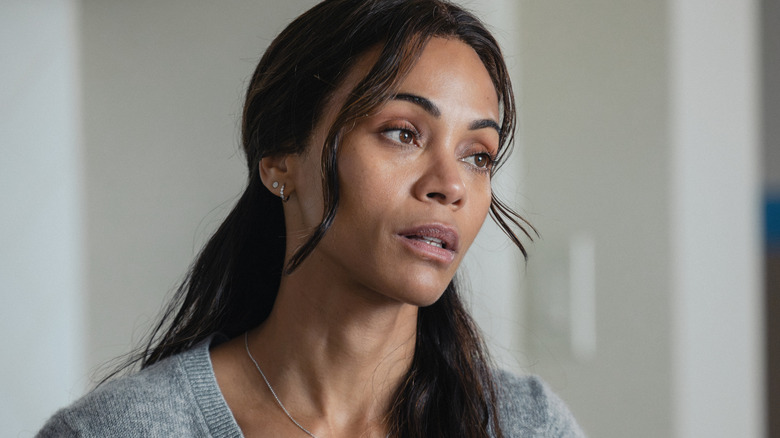 Zoe Saldaña's Joe McNamara is seen in closeup as she sits in her kitchen in Lioness