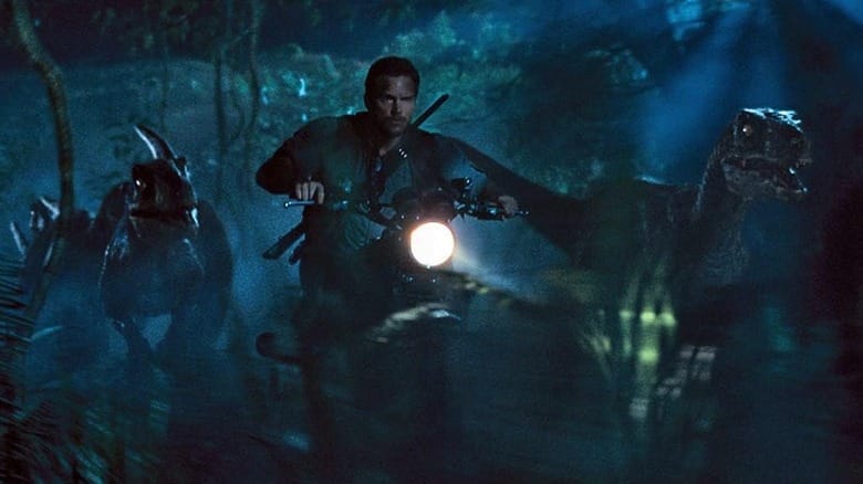 Chris Pratt as Owen Grady riding his motorcycle alongside some raptors in Jurassic World