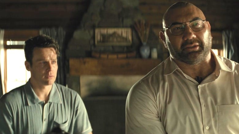 Jonathan Groff as Eric standing by Dave Bautista as Leonard in Knock at the Cabin