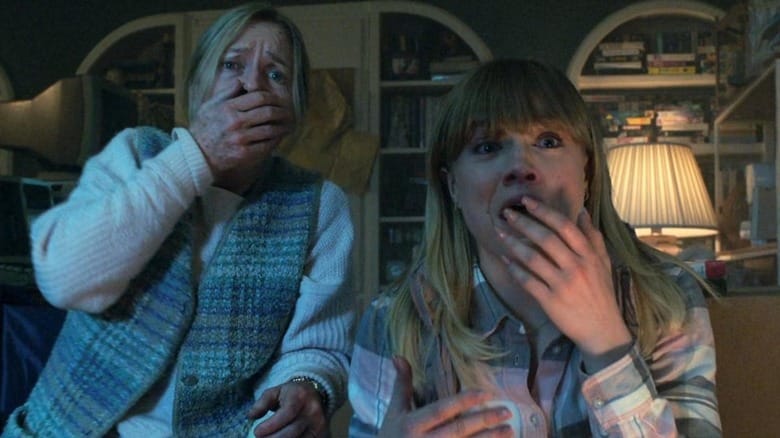 Susanna Thompson as Jeanne and Maddie Hasson as Sydney gasping at the TV in Malignant