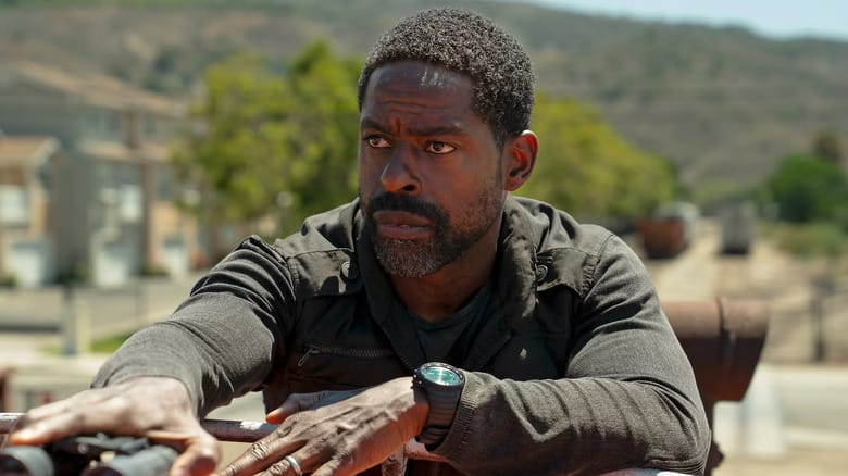 Sterling K. Brown as Xavier Collins in Paradise, looking off while holding on to a pair of binoculars.