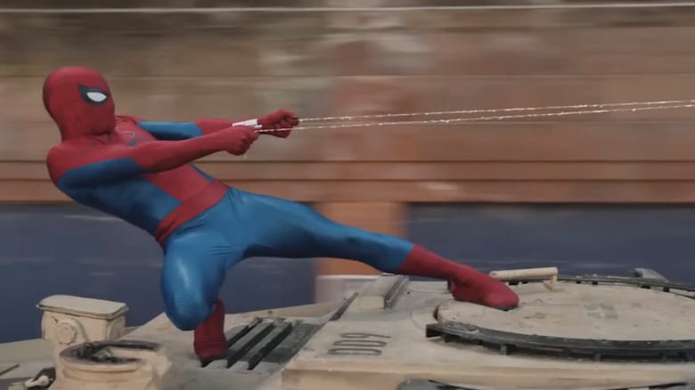 Spider-Man leaning back, hanging on to two strands of webbing, in Spider-Man: Brand New Day