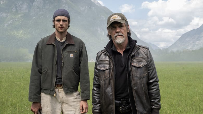 Jacob Elordi as Hig standing next to Josh Brolin as Bangley in a field in The Dog Stars