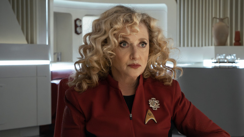 Pelia looking into the middle distance in a conference room on Star Trek: Strange New Worlds