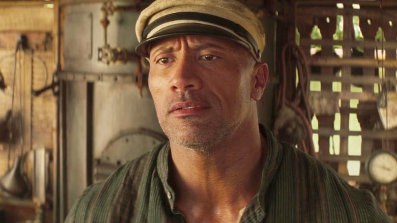 Dwayne Johnson as Jack Wolff looking annoyed while wearing his skipper hat in Jungle Cruise