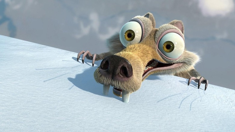 Scrat clings to a cliff edge with his teeth in Ice Age