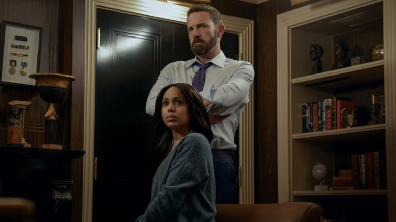 Mark standing behind Abigail in their house in Animals