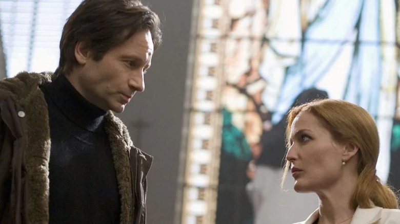 Fox Mulder and Dana Scully share a meaningful look in The X-Files: I Want to Believe