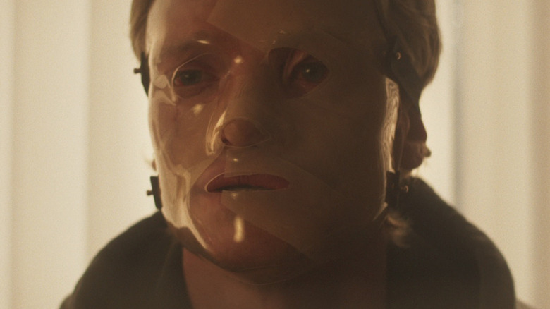 Tom Rhys Harries as Matt Hagen with his mask covering his face in Clayface