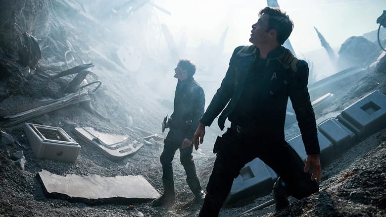 Chekov and Kirk looking up at something amid the wreckage of a crash in Star Trek Beyond