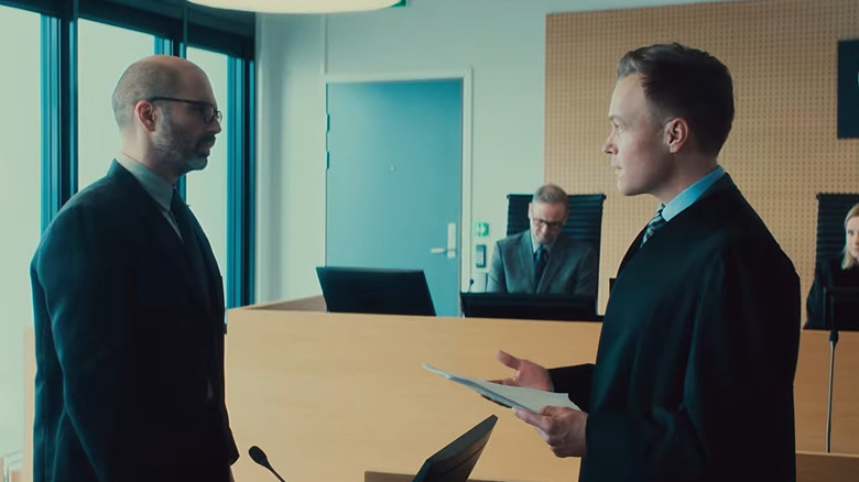 Mihai bring cross-examined by a Norewgian prosecutor