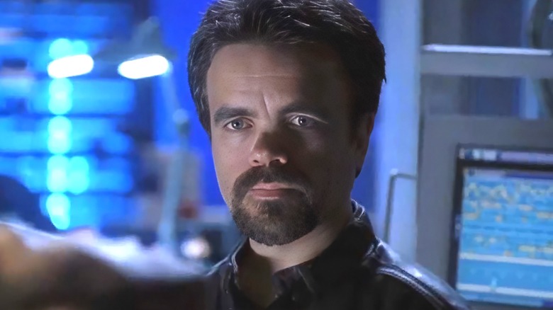 Arthur Ramsey looking at someone in Threshold
