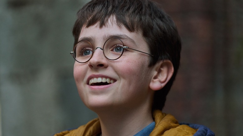 Harry looking up and smiling in Harry Potter and the Philosopher's Stone