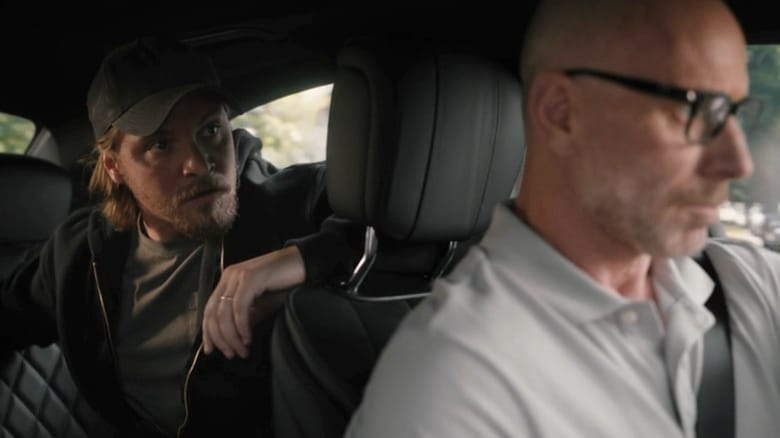 Matt Gerald's Grant Horton sits in a car with Luke Grimes' Kayce Dutton in the back seat in Yellowstone