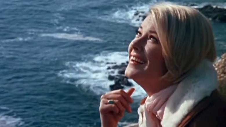 Hope Lange's Carolyn Muir looks up smiling by the sea in The Ghost and Mrs Muir.jpg