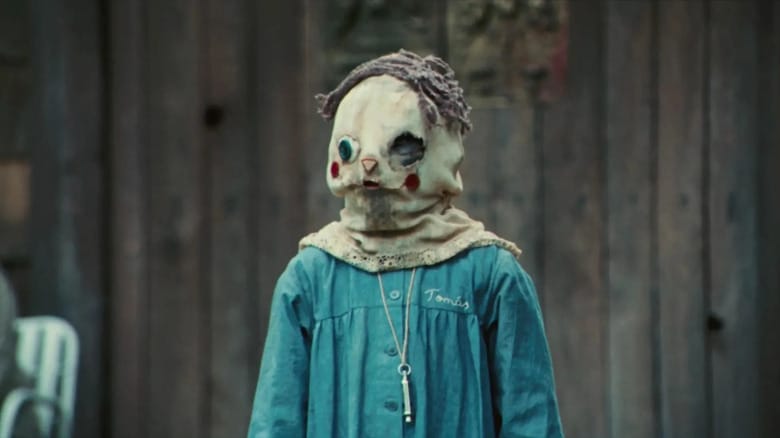 Óscar Casas (Tomás) stands wearing a sack on his head in The Orphanage (2007)