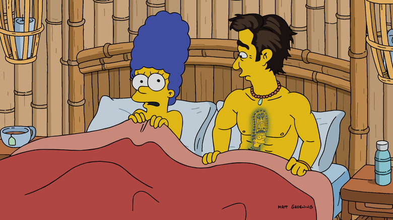 Marge wakes up in bed surprise to see Survivor host Jeff Probst next to her in The Simpsons