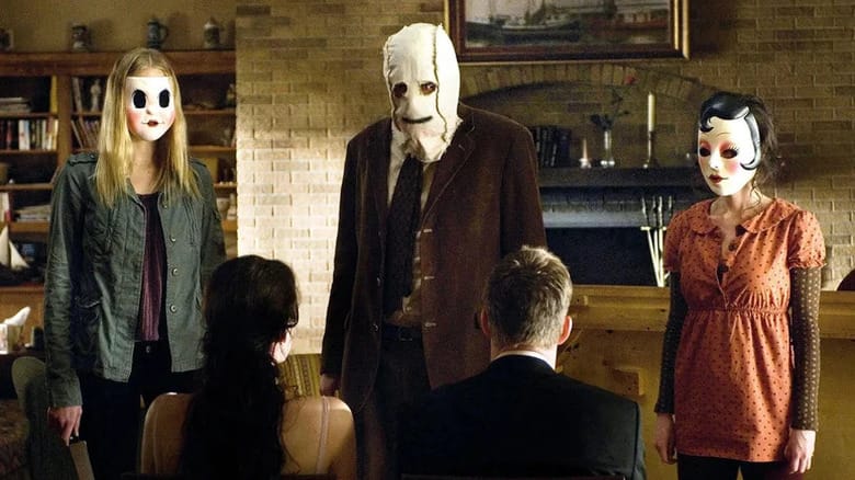 Kristen McKay (Liv Tyler) and James Hoyt (Scott Speedman) are bound and looking at their captors in The Strangers (2008)