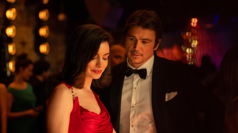 Anne Hathaway as Verity Crawford standing next to Josh Hartnett as Jeremy Crawford in Verity