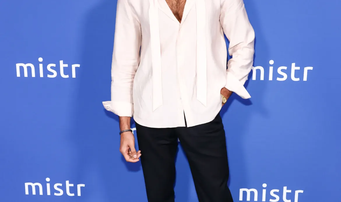 Sam Asghari poses on the blue carpet at MISTR's 2nd Annual National PrEP Day Celebration.